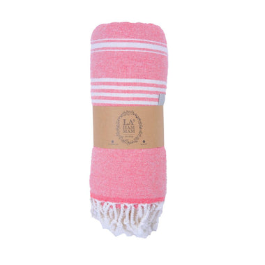 Pink towel with white stripes and fringes, branded 'La Ham', on a white background